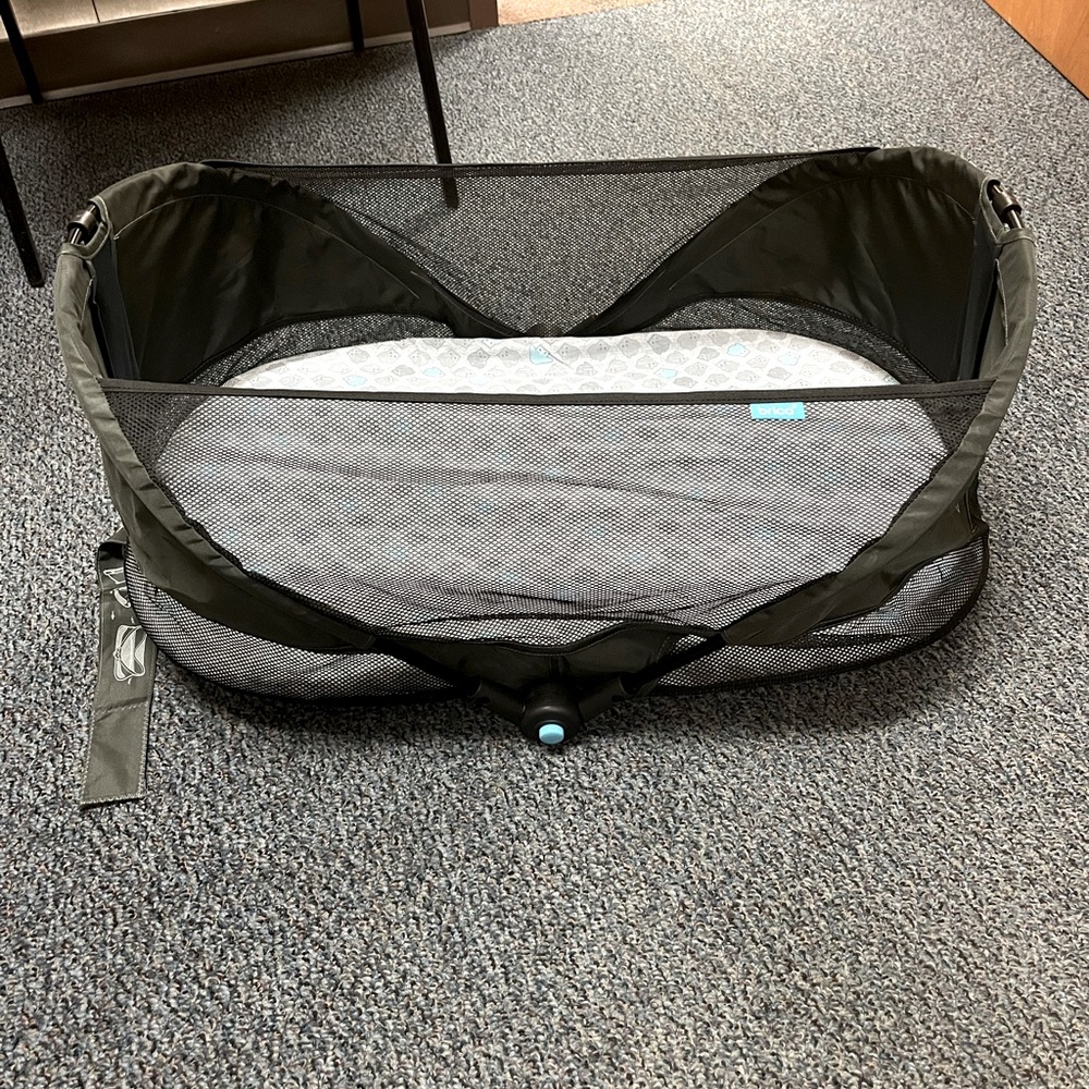 Folding travel bassinet - new